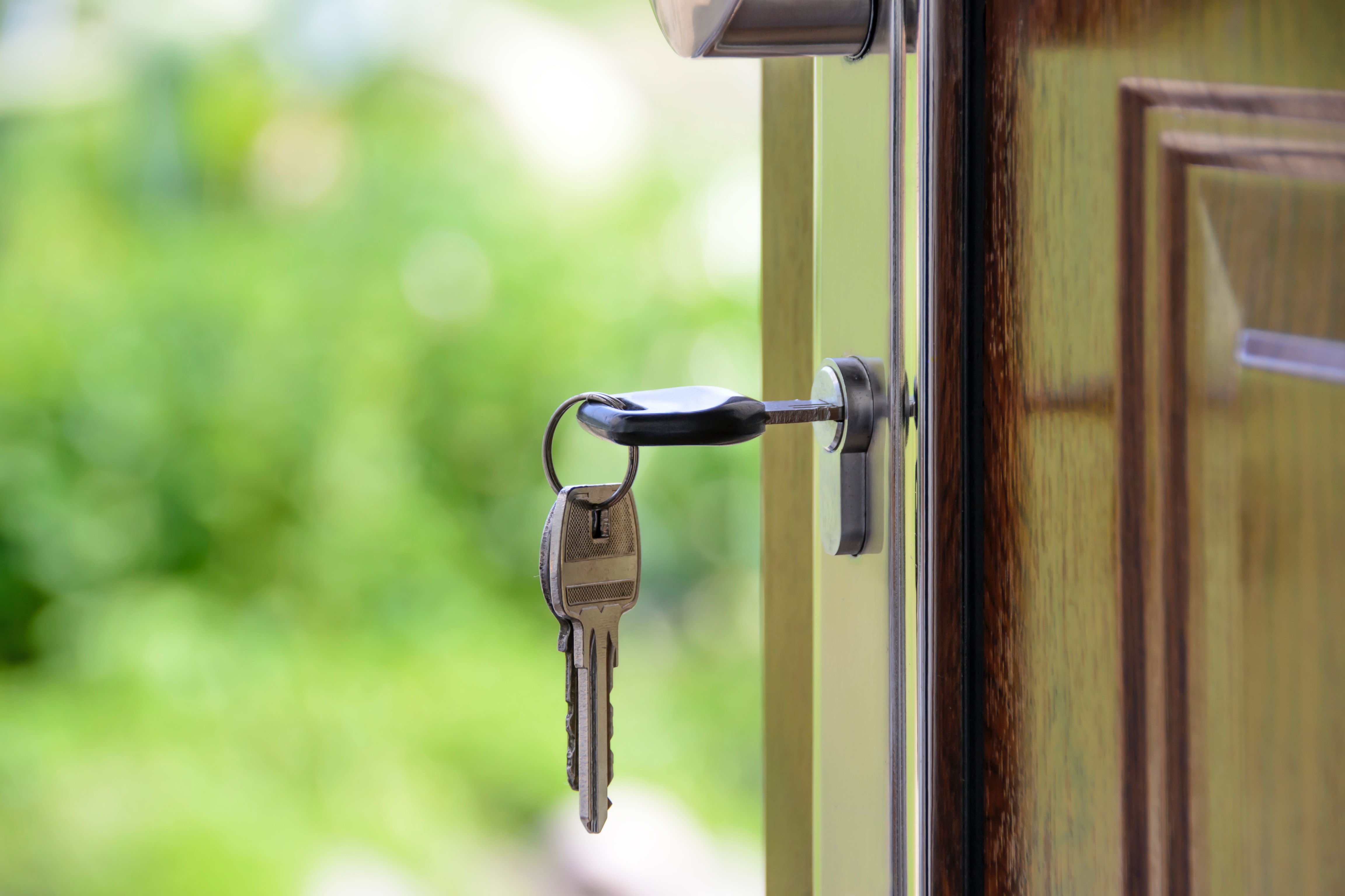 House keys dangling from a door lock